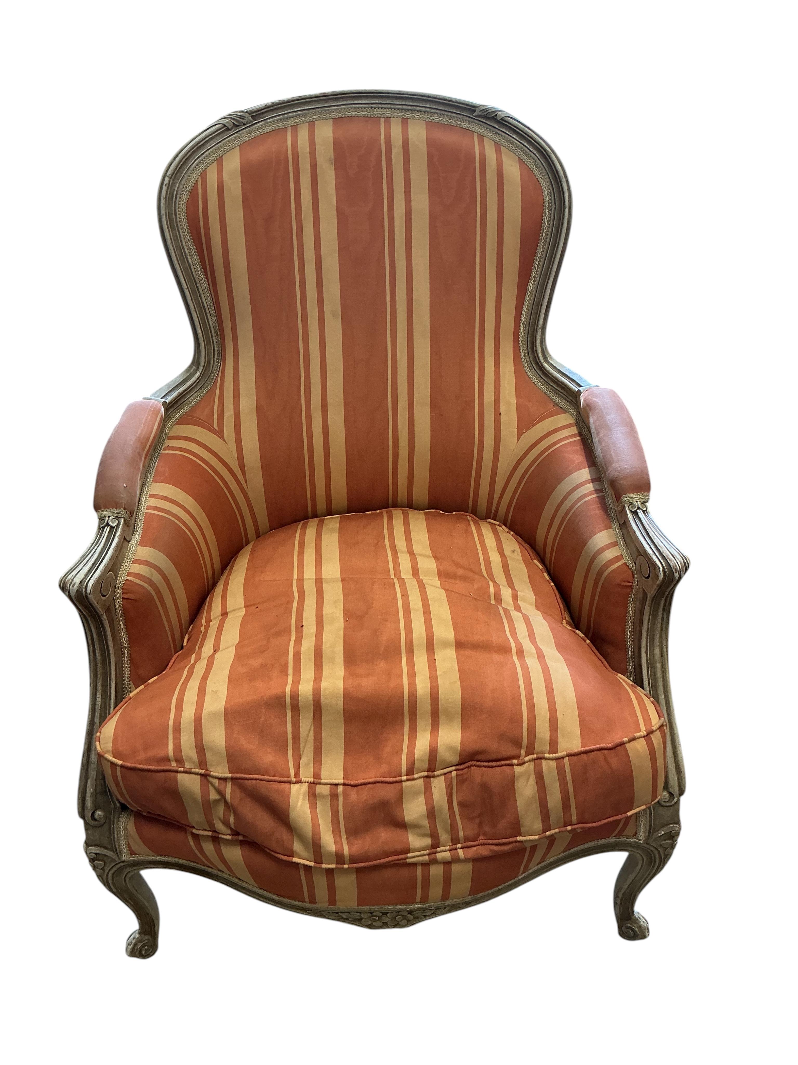 A pair of Louis XVI style painted upholstered armchairs, width 66cm, depth 60cm, height 88cm